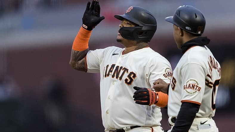 Jul 28, 2022; San Francisco, California, USA; San Francisco Giants designated hitter Yermin Mercedes (6) reacts next to first base coach Antoan Richardson (00) after hitting a bases-loaded two-run single against the Chicago Cubs during the third inning at Oracle Park. Mandatory Credit: John Hefti-USA TODAY Sports