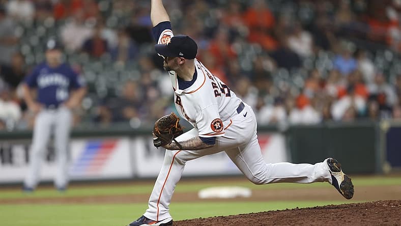 Jul 28, 2022; Houston, Texas, USA; Houston Astros relief pitcher Ryan Pressly (55) pitches against the Seattle Mariners in the ninth inning at Minute Maid Park. Mandatory Credit: Thomas Shea-USA TODAY Sports