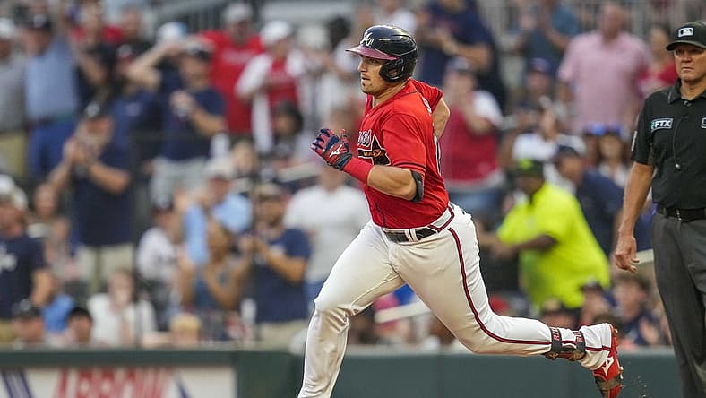Jul 29, 2022; Cumberland, Georgia, USA; Atlanta Braves third baseman Austin Riley (27) runs after hitting a double against the Arizona Diamondbacks during the third inning at Truist Park. Mandatory Credit: Dale Zanine-USA TODAY Sports