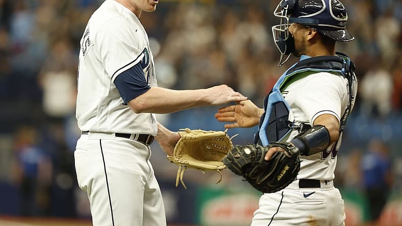 Jul 30, 2022; St. Petersburg, Florida, USA; Tampa Bay Rays relief pitcher Pete Fairbanks (29) and catcher Rene Pinto (50) celebrate as they beat the Cleveland Guardians at Tropicana Field. Mandatory Credit: Kim Klement-USA TODAY Sports