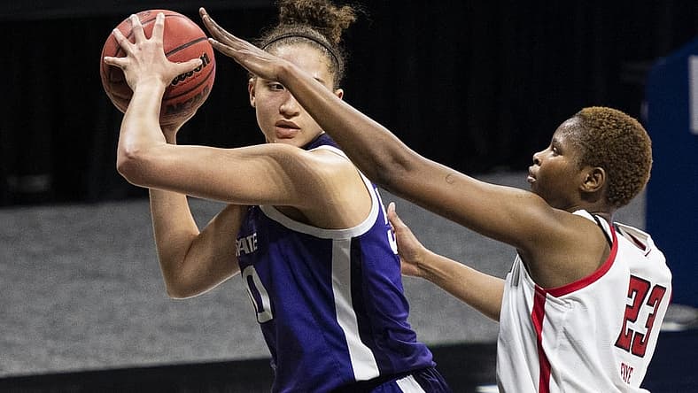 Mar 11, 2021; MO, Kansas City, USA; Kansas State Wildcats center Ayoka Lee (50) controls the ball against Texas Tech Lady Raiders center Khadija Faye (23) in the second half at Municipal Auditorium. Mandatory Credit: Amy Kontras-USA TODAY Sports