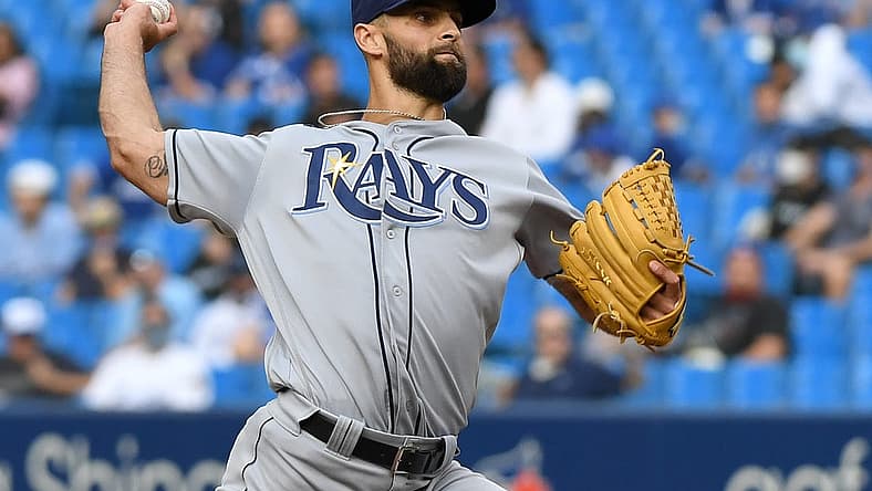 Sep 15, 2021; Toronto, Ontario, CAN;  Tampa Bay Rays relief pitcher Nick Anderson (70) delivers a pitch against Toronto Blue Jays in the eighth inning at Rogers Centre. Mandatory Credit: Dan Hamilton-USA TODAY Sports