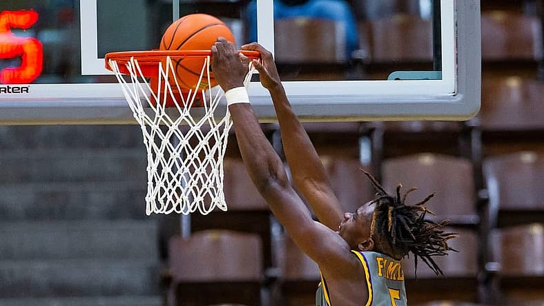 Legacy Early College's Coen Carr dunks during the LaLumiere vs. Legacy Early College NIBC Tournament basketball game Thursday, Jan. 6, 2022 at the LaPorte Civic Auditorium.

La Lumiere Vs Legacy Early College