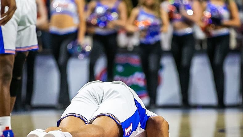 Florida Gators forward Keyontae Johnson (11) kisses the Gator logo after ceremonially starting the game Saturday. Johnson fainted during a game last year and took a one lump sum of $5 million insurance payout. The Kentucky Wildcats lead 38-26 at the half over the Florida Gators Saturday afternoon, March 5, 2022 at the Stephen C. O'Connell Center in Gainesville, FL. [Doug Engle/Ocala Star Banner]2022

Gai Uf Kentucky Basketball