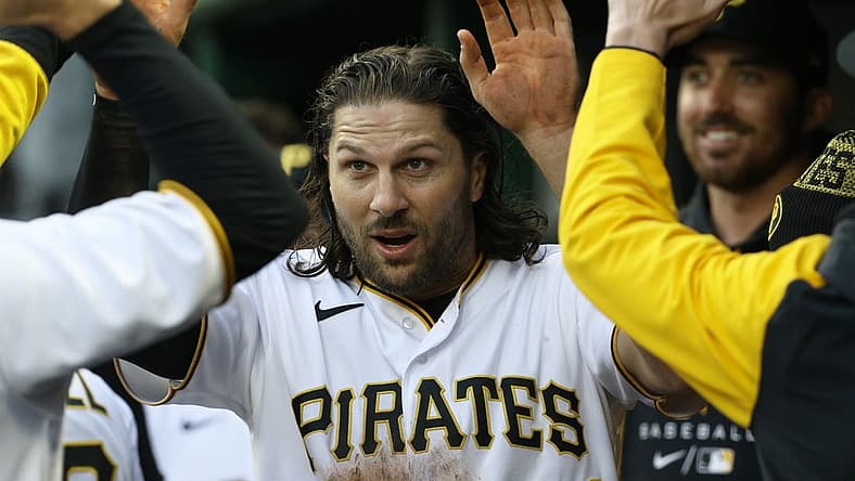 Apr 16, 2022; Pittsburgh, Pennsylvania, USA; Pittsburgh Pirates left fielder Jake Marisnick (41) high-fives in the dugout after scoring a run against the Washington Nationals during the second inning at PNC Park. Mandatory Credit: Charles LeClaire-USA TODAY Sports