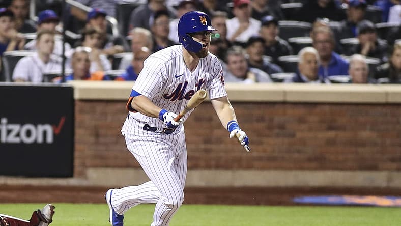 May 18, 2022; New York City, New York, USA; New York Mets catcher Patrick Mazeika (4) hits a double in the fourth inning against the St. Louis Cardinals at Citi Field. Mandatory Credit: Wendell Cruz-USA TODAY Sports
