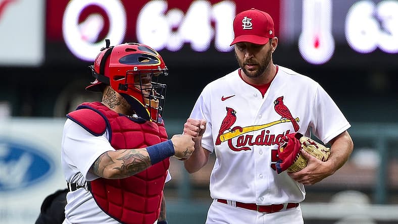 St. Louis Cardinals starting pitcher Adam Wainwright (50) and catcher Yadier Molina (4) walk in from the bullpen before a game against the Milwaukee Brewers at Busch Stadium. Mandatory Credit: Jeff Curry-USA TODAY Sports