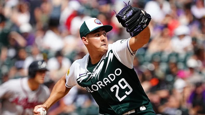 Jun 5, 2022; Denver, Colorado, USA; Colorado Rockies relief pitcher Robert Stephenson (29) delivers a pitch in the seventh against the Atlanta Braves at Coors Field. Mandatory Credit: Ron Chenoy-USA TODAY Sports