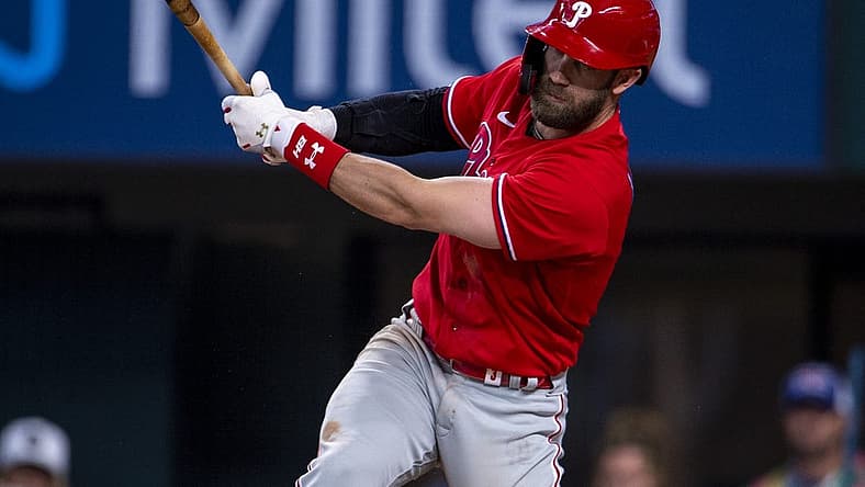Jun 22, 2022; Arlington, Texas, USA; Philadelphia Phillies designated hitter Bryce Harper (3) breaks his bat while batting against the Texas Rangers during the eighth inning at Globe Life Field. Mandatory Credit: Jerome Miron-USA TODAY Sports