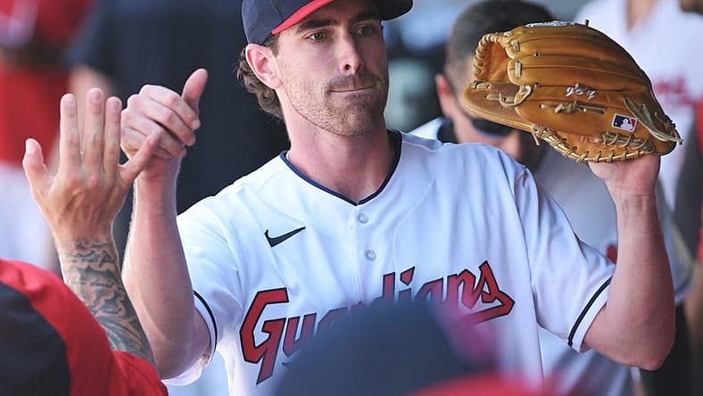 Jul 12, 2022; Cleveland, Ohio, USA; Cleveland Guardians starting pitcher Shane Bieber (57) celebrates in the dugout during the eighth inning against the Chicago White Sox at Progressive Field. Mandatory Credit: Ken Blaze-USA TODAY Sports