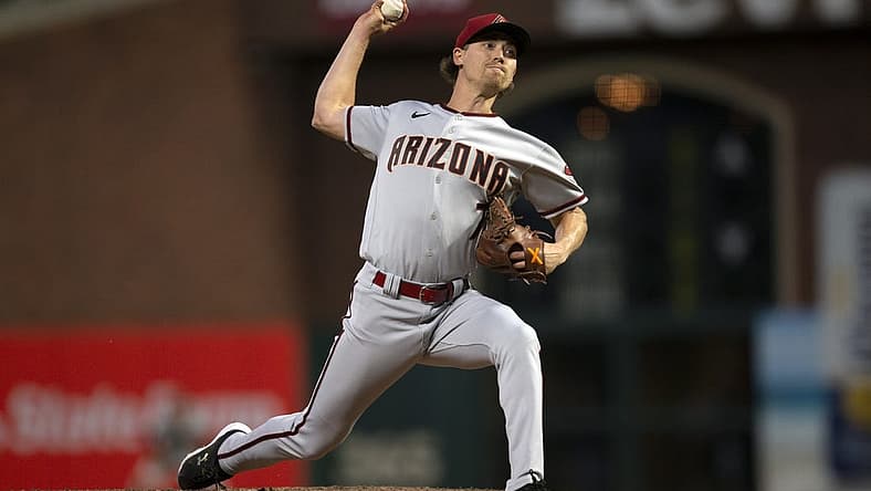 Jul 12, 2022; San Francisco, California, USA; Arizona Diamondbacks pitcher Luke Weaver (7) throws a pitch against the San Francisco Giants during the sixth inning at Oracle Park. Mandatory Credit: D. Ross Cameron-USA TODAY Sports