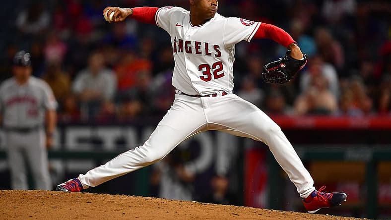 Jul 12, 2022; Anaheim, California, USA; Los Angeles Angels relief pitcher Raisel Iglesias (32) throws against the Houston Astros during the ninth inning at Angel Stadium. Mandatory Credit: Gary A. Vasquez-USA TODAY Sports