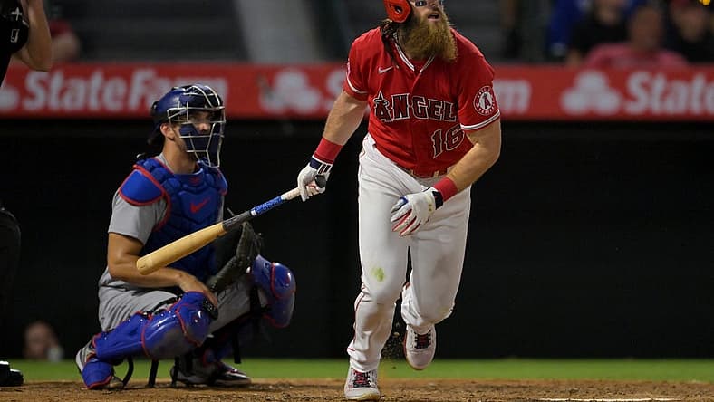Jul 15, 2022; Anaheim, California, USA; Los Angeles Angels left fielder Brandon Marsh (16) hits a solo home run in the ninth inning against the Los Angeles Dodgers at Angel Stadium. Mandatory Credit: Jayne Kamin-Oncea-USA TODAY Sports