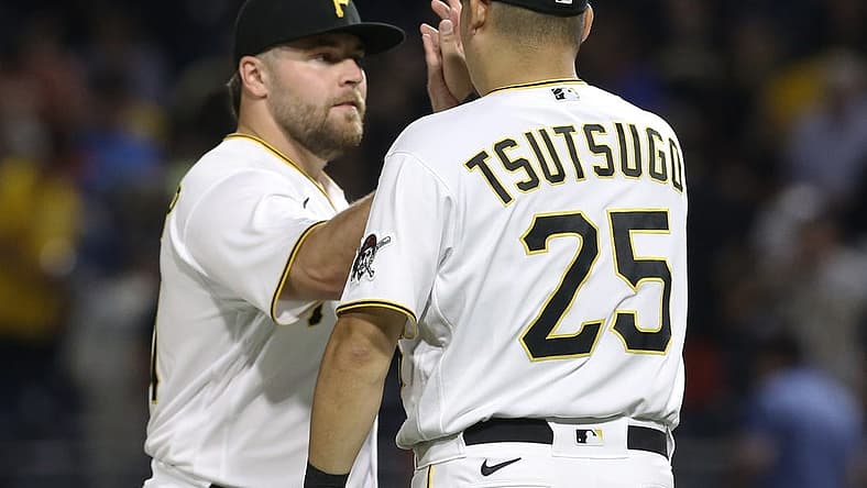 Jul 23, 2022; Pittsburgh, Pennsylvania, USA; Pittsburgh Pirates relief pitcher David Bednar (left) and designated hitter first baseman Yoshi Tsutsugo (25) celebrate after defeating the Miami Marlins at PNC Park. The Pirates shutout the Marlins 1-0. Mandatory Credit: Charles LeClaire-USA TODAY Sports