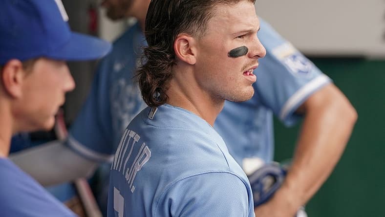 Jul 24, 2022; Kansas City, Missouri, USA; Kansas City Royals shortstop Bobby Witt Jr. (7) watches play against the Tampa Bay Rays from the dugout in the first inning at Kauffman Stadium. Mandatory Credit: Denny Medley-USA TODAY Sports