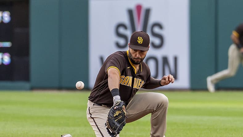Jul 25, 2022; Detroit, Michigan, USA; San Diego Padres first baseman Eric Hosmer (30) makes a fielding error during the third inning on a ground ball from Detroit Tigers first baseman Harold Castro (30) at Comerica Park. Mandatory Credit: Raj Mehta-USA TODAY Sports