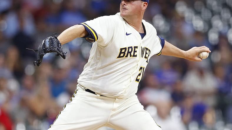 Jul 25, 2022; Milwaukee, Wisconsin, USA; Milwaukee Brewers pitcher Jake McGee (21) throws a pitch during the seventh inning against the Colorado Rockies at American Family Field. Mandatory Credit: Jeff Hanisch-USA TODAY Sports
