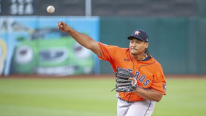 Jul 26, 2022; Oakland, California, USA; Houston Astros starting pitcher Luis Garcia (77) throws a pitch against the Oakland Athletics during the first inning at RingCentral Coliseum. Mandatory Credit: Ed Szczepanski-USA TODAY Sports