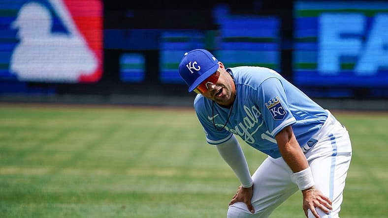 Jul 24, 2022; Kansas City, Missouri, USA; Kansas City Royals second baseman Whit Merrifield (15) stretches prior to the game against the Tampa Bay Rays at Kauffman Stadium. Mandatory Credit: Denny Medley-USA TODAY Sports