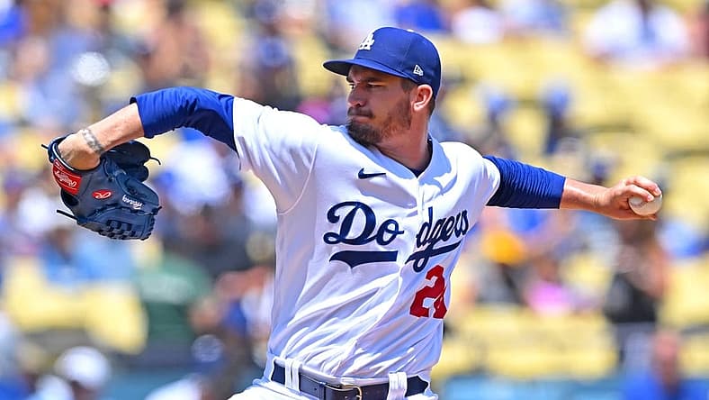 Jul 27, 2022; Los Angeles, California, USA; Los Angeles Dodgers starting pitcher Andrew Heaney (28) throws to the plate in the first inning against the Washington Nationals at Dodger Stadium. Mandatory Credit: Jayne Kamin-Oncea-USA TODAY Sports