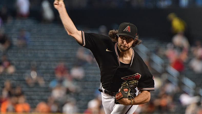 Jul 27, 2022; Phoenix, Arizona, USA; Arizona Diamondbacks starting pitcher Zac Gallen (23) throws in the fifth inning against the San Francisco Giants at Chase Field. Mandatory Credit: Matt Kartozian-USA TODAY Sports