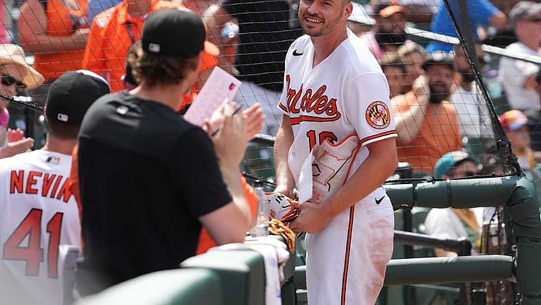 Jul 28, 2022; Baltimore, Maryland, USA; Baltimore Orioles designated hitter Trey Mancini (16) takes a curtain call following his two-run, inside-the-park home run in the eighth inning against the Tampa Bay Rays at Oriole Park at Camden Yards. Mandatory Credit: Mitch Stringer-USA TODAY Sports