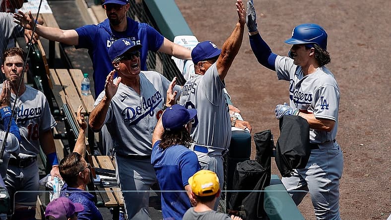 Jul 31, 2022; Denver, Colorado, USA; Los Angeles Dodgers right fielder James Outman (77) celebrates with manager Dave Roberts (30) and bench coach Bob Geren (88) after hitting a home run on his first career at bat in the first inning against the Colorado Rockies at Coors Field. Mandatory Credit: Isaiah J. Downing-USA TODAY Sports