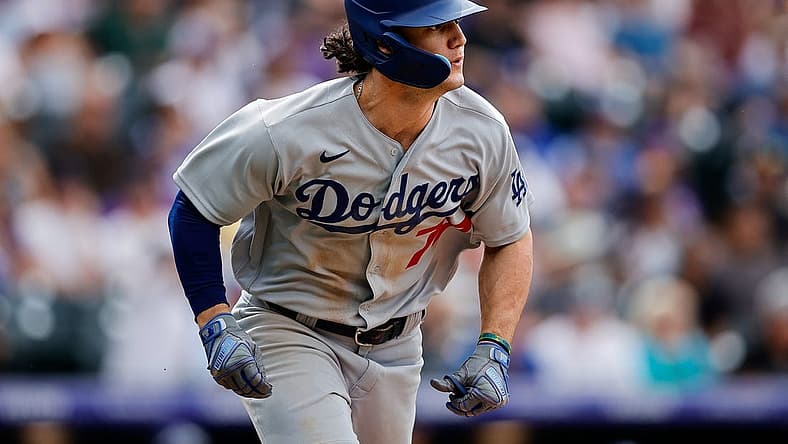 Jul 31, 2022; Denver, Colorado, USA; Los Angeles Dodgers right fielder James Outman (77) watches his ball on an RBI double in the eighth inning against the Colorado Rockies at Coors Field. Mandatory Credit: Isaiah J. Downing-USA TODAY Sports