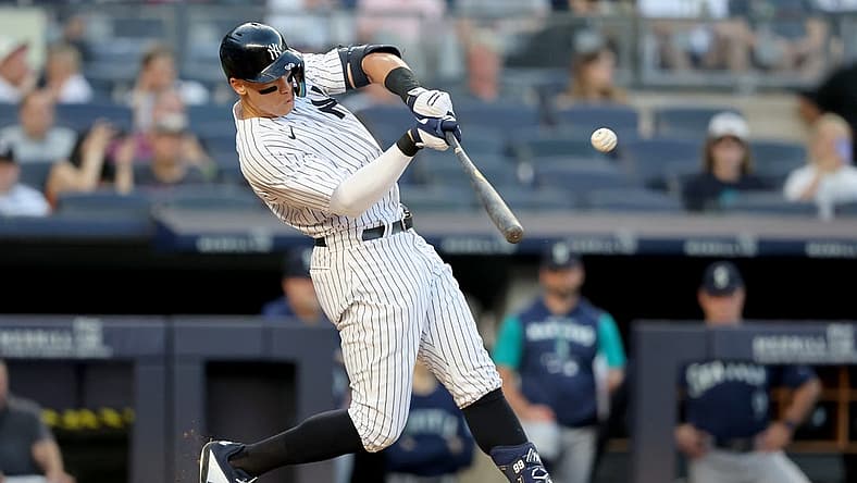 Aug 1, 2022; Bronx, New York, USA; New York Yankees right fielder Aaron Judge (99) hits a two run home run against the Seattle Mariners during the second inning at Yankee Stadium. Mandatory Credit: Brad Penner-USA TODAY Sports