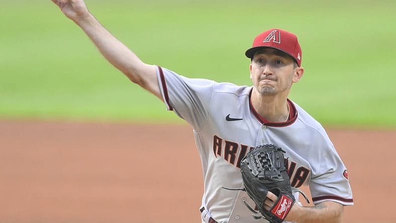 Aug 1, 2022; Cleveland, Ohio, USA; Arizona Diamondbacks starting pitcher Zach Davies (27) delivers a pitch in the first inning against the Cleveland Guardians at Progressive Field. Mandatory Credit: David Richard-USA TODAY Sports