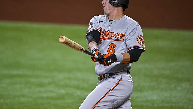Aug 1, 2022; Arlington, Texas, USA; Baltimore Orioles first baseman Ryan Mountcastle (6) hits a single and drives in a run against the Texas Rangers during the second inning at Globe Life Field. Mandatory Credit: Jerome Miron-USA TODAY Sports