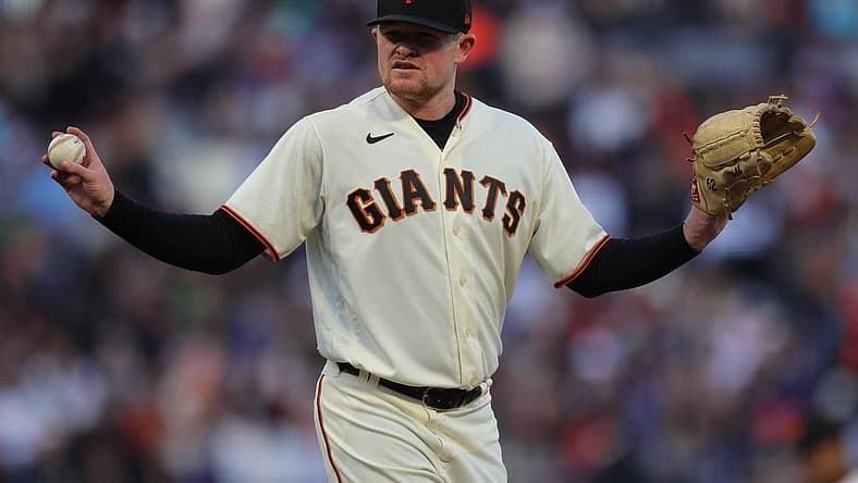 Aug 1, 2022; San Francisco, California, USA; San Francisco Giants starting pitcher Logan Webb (62) reacts during the second inning against the Los Angeles Dodgers at Oracle Park. Mandatory Credit: Sergio Estrada-USA TODAY Sports
