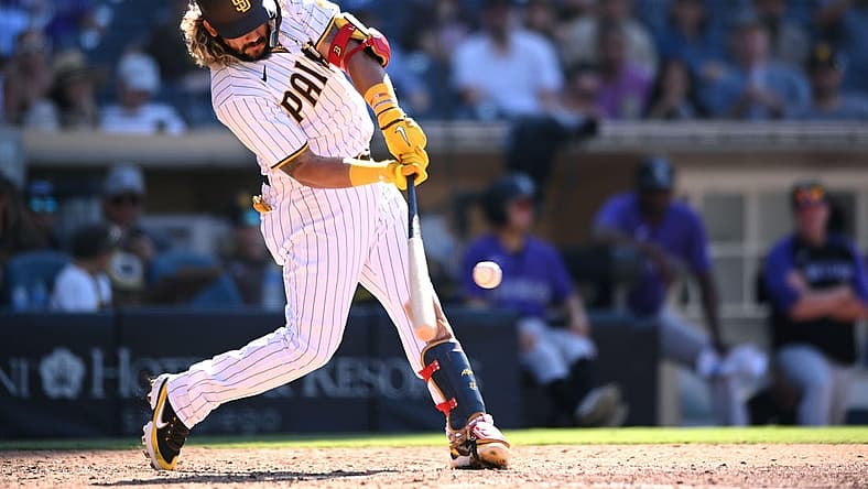 Aug 2, 2022; San Diego, California, USA; San Diego Padres designated hitter Jorge Alfaro (38) hits an RBI single during the seventh inning against the Colorado Rockies at Petco Park. Mandatory Credit: Orlando Ramirez-USA TODAY Sports