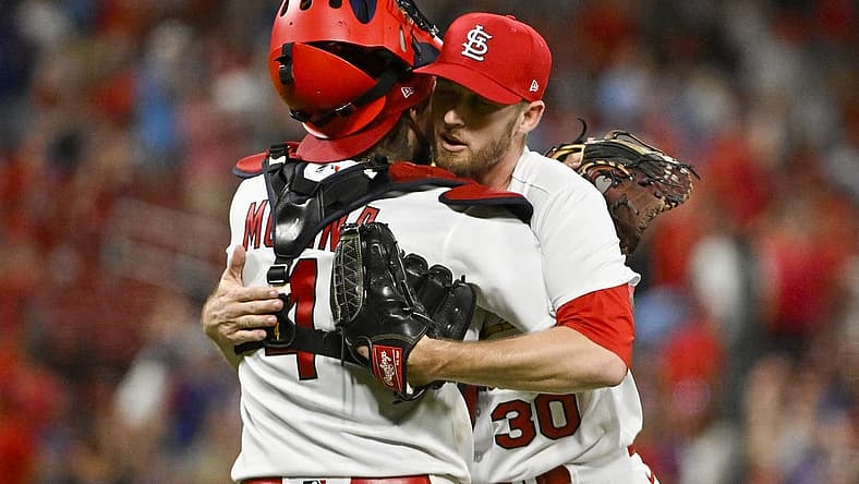 Aug 2, 2022; St. Louis, Missouri, USA; St. Louis Cardinals relief pitcher Chris Stratton (30) celebrates with catcher Yadier Molina (4) after the Cardinals defeated the Chicago Cubs at Busch Stadium. Mandatory Credit: Jeff Curry-USA TODAY Sports