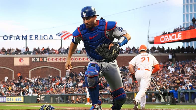 Aug 2, 2022; San Francisco, California, USA; Los Angeles Dodgers catcher Austin Barnes (15) chases down the ball after a wild pitch against the San Francisco Giants during the fourth inning at Oracle Park. Mandatory Credit: Kelley L Cox-USA TODAY Sports