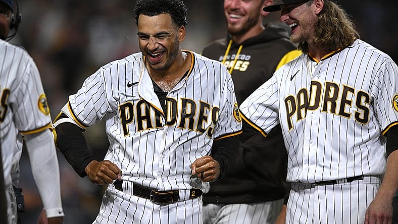 Aug 2, 2022; San Diego, California, USA; San Diego Padres center fielder Trent Grisham (left) celebrates his walk-off home run against the Colorado Rockies with relief pitcher Josh Hader (right) at Petco Park. Mandatory Credit: Orlando Ramirez-USA TODAY Sports