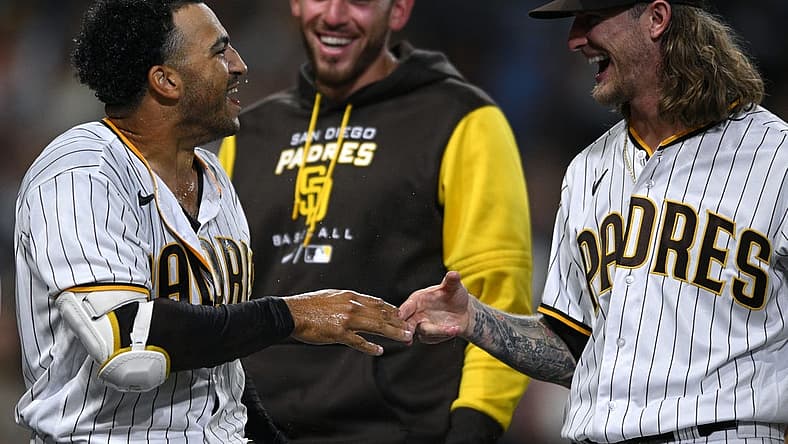 Aug 2, 2022; San Diego, California, USA; San Diego Padres center fielder Trent Grisham (left) celebrates his walk-off home run against the Colorado Rockies with relief pitcher Josh Hader (right) at Petco Park. Mandatory Credit: Orlando Ramirez-USA TODAY Sports