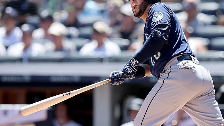 Aug 3, 2022; Bronx, New York, USA; Seattle Mariners third baseman Eugenio Suarez (28) follows through on a three run home run against the New York Yankees during the first inning at Yankee Stadium. Mandatory Credit: Brad Penner-USA TODAY Sports