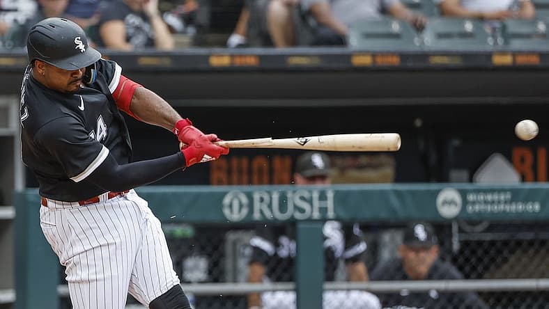 Aug 3, 2022; Chicago, Illinois, USA; Chicago White Sox left fielder Eloy Jimenez (74) breaks his bat on a single against the Kansas City Royals during the third inning at Guaranteed Rate Field. Mandatory Credit: Kamil Krzaczynski-USA TODAY Sports