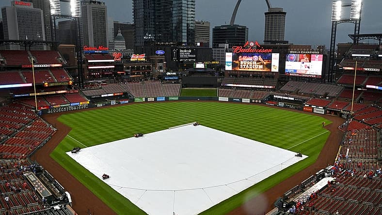 Aug 3, 2022; St. Louis, Missouri, USA;  Rain falls as the tarp covers the field before a game between the St. Louis Cardinals and the Chicago Cubs at Busch Stadium. Mandatory Credit: Jeff Curry-USA TODAY Sports