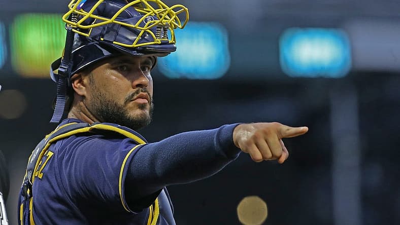 Aug 3, 2022; Pittsburgh, Pennsylvania, USA; Milwaukee Brewers catcher Omar Narvaez (10) gestures to the Brewers dugout from behind home plate against the Pittsburgh Pirates during the fourth inning at PNC Park. Mandatory Credit: Charles LeClaire-USA TODAY Sports