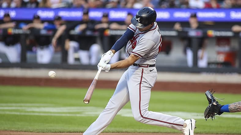 Aug 5, 2022; New York City, New York, USA;  Atlanta Braves first baseman Matt Olson (28) hits a double in the first inning against the New York Mets at Citi Field. Mandatory Credit: Wendell Cruz-USA TODAY Sports