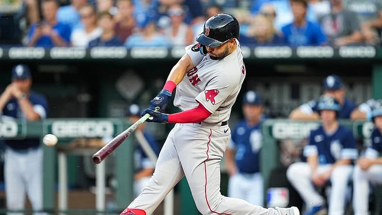 Aug 5, 2022; Kansas City, Missouri, USA; Boston Red Sox first baseman Eric Hosmer (35) hits an RBI double against the Kansas City Royals during the second inning at Kauffman Stadium. Mandatory Credit: Jay Biggerstaff-USA TODAY Sports