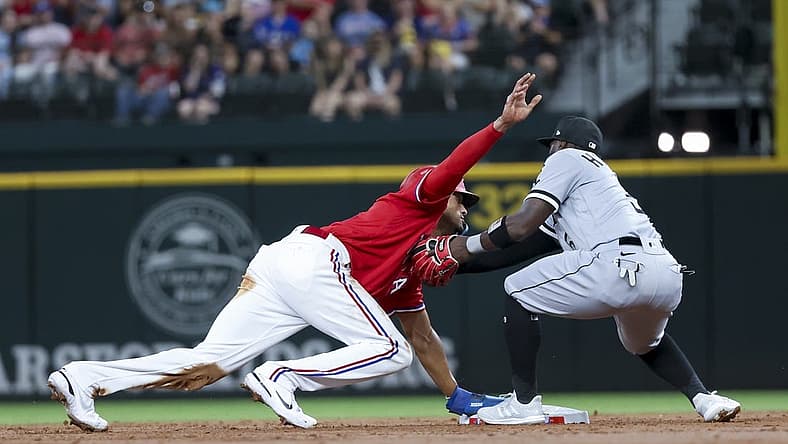 Aug 5, 2022; Arlington, Texas, USA; Texas Rangers left fielder Bubba Thompson (65) steals second base ahead of the tag by Chicago White Sox second baseman Josh Harrison (5) during the second inning at Globe Life Field. Mandatory Credit: Kevin Jairaj-USA TODAY Sports