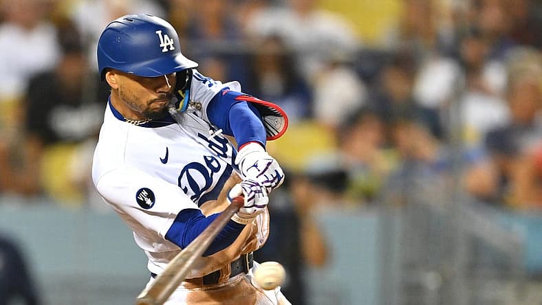 Aug 5, 2022; Los Angeles, California, USA; Los Angeles Dodgers right fielder Mookie Betts (50) singles in the sixth inning against the San Diego Padres at Dodger Stadium. Mandatory Credit: Jayne Kamin-Oncea-USA TODAY Sports