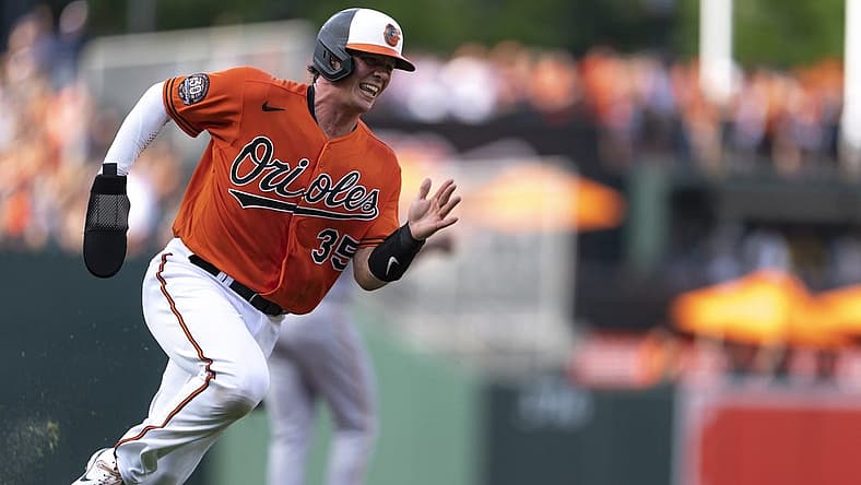 Aug 6, 2022; Baltimore, Maryland, USA; Baltimore Orioles catcher Adley Rutschman (35) rounds third base to score a run in the first inning  at Oriole Park at Camden Yards. Mandatory Credit: Brent Skeen-USA TODAY Sports