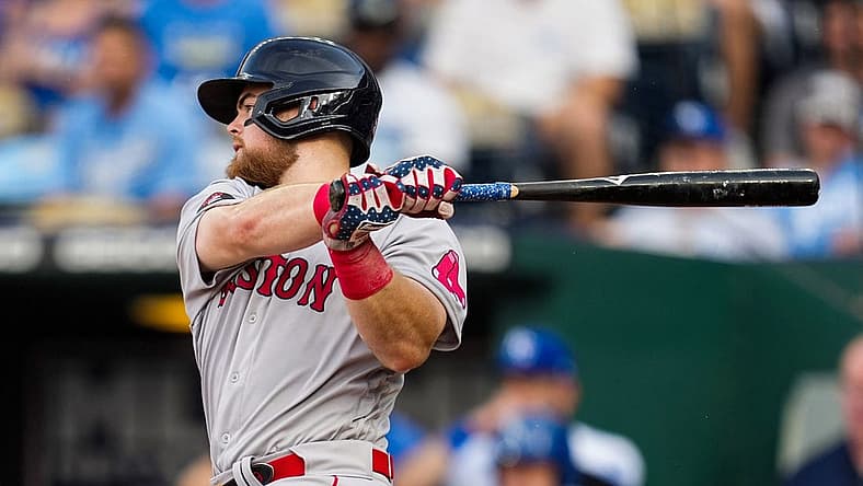 Aug 6, 2022; Kansas City, Missouri, USA; Boston Red Sox first baseman Bobby Dalbec (29) hits a single against the Kansas City Royals during the second inning at Kauffman Stadium. Mandatory Credit: Jay Biggerstaff-USA TODAY Sports