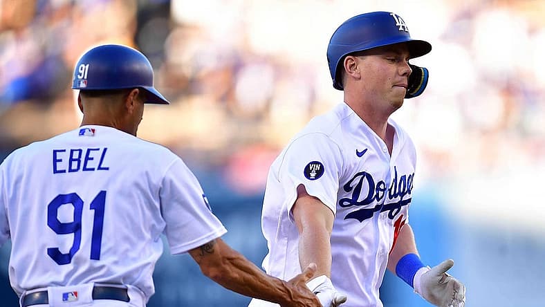 Aug 6, 2022; Los Angeles, California, USA; Los Angeles Dodgers designated hitter Will Smith (16) is greeted by third base coach Dino Ebel (91) after hitting a solo home run against the San Diego Padres during the second inning at Dodger Stadium. Mandatory Credit: Gary A. Vasquez-USA TODAY Sports