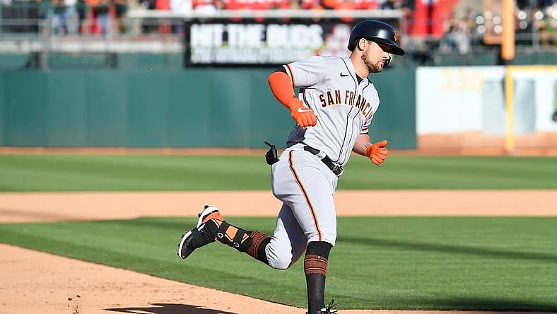 Aug 6, 2022; Oakland, California, USA; San Francisco Giants designated hitter J.D. Davis (7) rounds third base after hitting a solo home run against the Oakland Athletics during the sixth inning at RingCentral Coliseum. Mandatory Credit: Robert Edwards-USA TODAY Sports