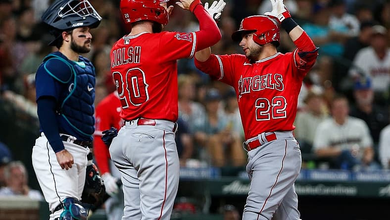 Aug 6, 2022; Seattle, Washington, USA;  Los Angeles Angels first baseman Jared Walsh (20) greets shortstop David Fletcher (22) after Fletcher hit a two-run home run against the Seattle Mariners during the sixth inning at T-Mobile Park. Mandatory Credit: Lindsey Wasson-USA TODAY Sports